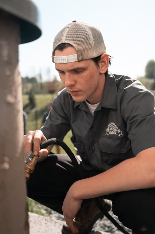 An All Seasons HVAC team member at work