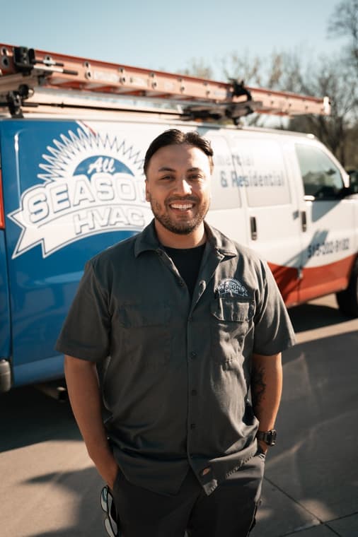 An All Seasons HVAC team member on a service call